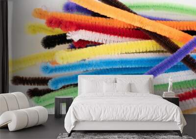 Range of loose Neon colored pipe cleaners on a white background Wall mural