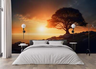 Silhouette of a tree with sun rays in the background. 
 Wall mural