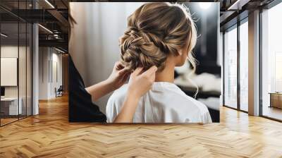 A girl hairstylist working on a bridal updo Wall mural