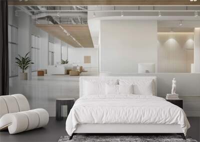 A large, empty office space with a white wall and a white desk. The room is filled with natural light and has a modern, minimalist design Wall mural