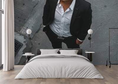 Aerial shot of a young man in business attire. Wall mural