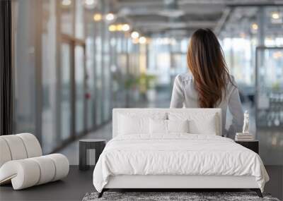 Business girl in a modern office with ample space for text. Wall mural