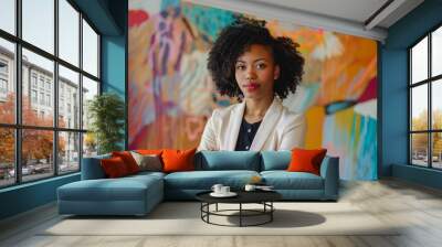 Businesswoman with a striking abstract color backdrop. Wall mural