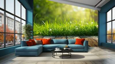 green spring background panorama with grass in front of a wooden table for a concept Wall mural