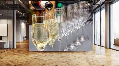 close-up of condensed champagne flutes arranged on table Wall mural