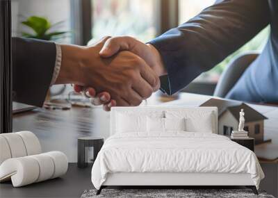 Business Handshake Over a Real Estate Contract and Model House Wall mural