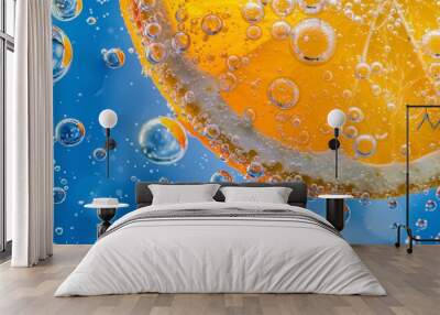 orange in water, a slice of orange submerged in a clear, bubbly liquid Wall mural