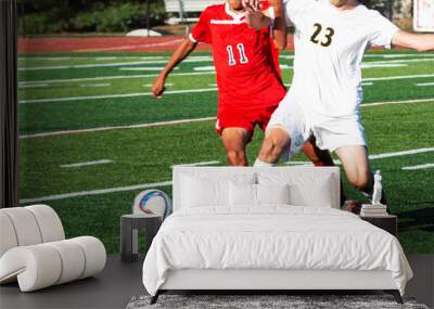 Two high school soccer players fighting for the ball Wall mural