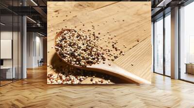 mixed quinoa seeds on spoon on wooden kitchen top Wall mural