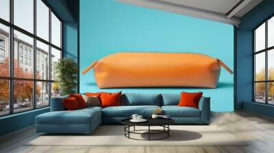 Orange pencil case isolated on blue background. Wall mural