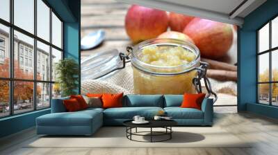 close on homemade compote  in a glass  jar with red apples  background Wall mural