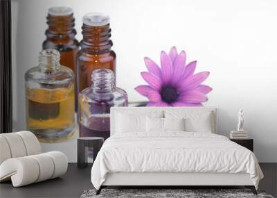 essential oil bottles and flower on white background Wall mural