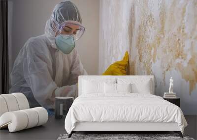 Professional mold removal worker cleaning a wall Wall mural