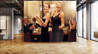 Dance, singing and portrait of women at an event for new years, birthday celebration or party. Smile, happy and mature, elegant and classy friends at a social gala for dancing and to sing at a venue Wall mural