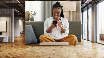 Happy, black woman and credit card with phone on sofa for online shopping, payment code and fintech at home. Mobile banking, finance and password to upgrade subscription, ecommerce and money savings Wall mural