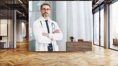 Healthcare, leadership and portrait of doctor, man in hospital for support, success and help in medical work. Health, wellness and medicine, confident mature professional with stethoscope and mockup. Wall mural