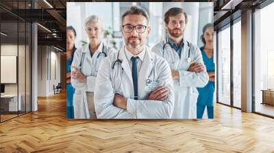 Healthcare, leadership and team portrait of doctor and nurses in hospital with support and serious teamwork. Health, help and medicine confident doctors and professional medical employees together Wall mural