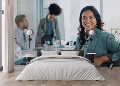 Laptop, portrait and business woman in meeting at office for company budget planning with revenue. Smile, computer and Asian female financial analyst with team for corporate stock investment pride Wall mural