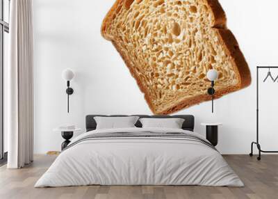 One delicious falling slice of bread on white background Wall mural