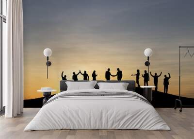 Silhouette group of business people are celebrating success at sunlight background. Business and goal concept. Wall mural