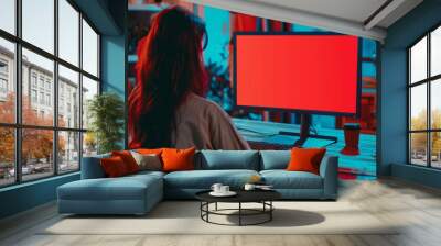 Digital mockup woman in her 30s in front of a computer with an entirely red screen Wall mural