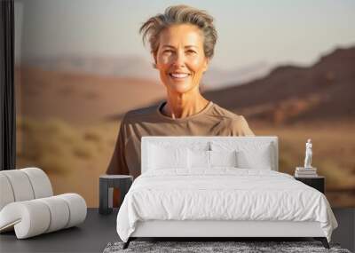 Portrait of a blissful woman in her 50s sporting a technical climbing shirt against a backdrop of desert dunes. AI Generation Wall mural