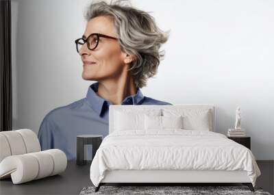 Portrait of a content woman in her 50s sporting a technical climbing shirt over white background Wall mural