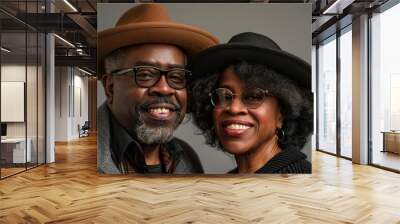 Portrait of a grinning afro-american couple in their 40s looking at the camera Wall mural