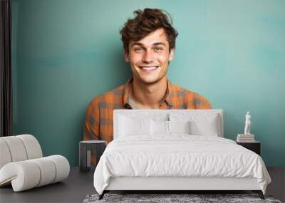 Portrait of a happy man in his 20s dressed in a relaxed flannel shirt against a solid color backdrop. AI Generation Wall mural