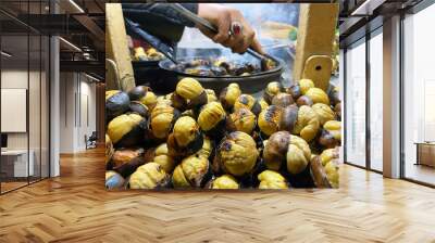 Details of roasted chestnuts at street food kiosk  Wall mural