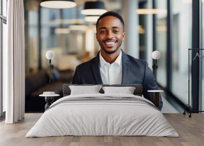 Portrait of a smiling young businessman in office Wall mural