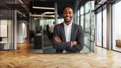 Portrait of a smiling young businessman in office Wall mural