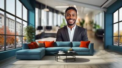 Portrait of a smiling young businessman in office Wall mural