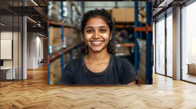 Portrait of a smiling young female adult warehouse worker Wall mural