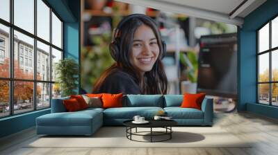 Portrait of a smiling young female IT support worker in startup company office Wall mural