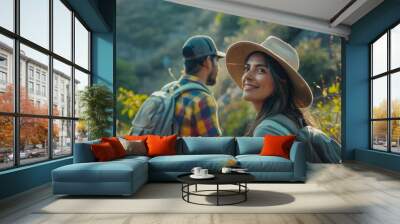 Portrait of a young couple hiking in beautiful scenery Wall mural