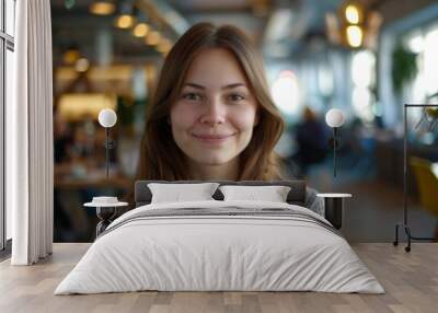 Portrait of a young female worker in startup company office Wall mural