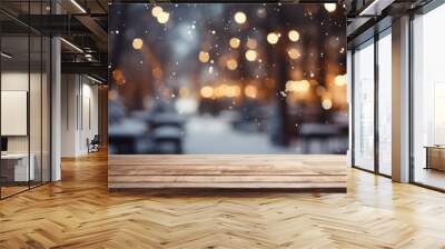 Snowy empty wooden table with blurred Christmas background Wall mural