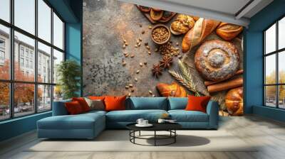 Assorted fresh baked goods with spices on rustic textured background Wall mural