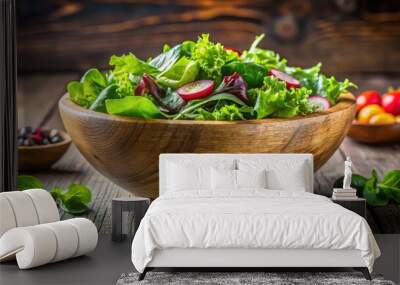 Fresh green salad leaves in a rustic wooden bowl for healthy food concept Wall mural