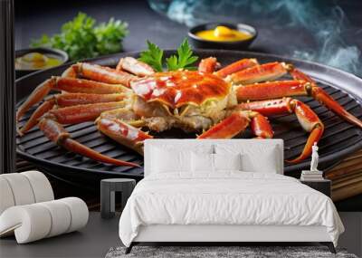 Grilled snow crab with melted butter served on a sizzling iron plate Wall mural