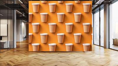 Pattern of paper cups on orange background with space for text Wall mural