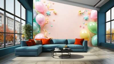 Top view of minimal style composition with pastel color air balloons, streamer ribbons, and children birthday party attributes on bright background, perfect for a festive celebrati Wall mural