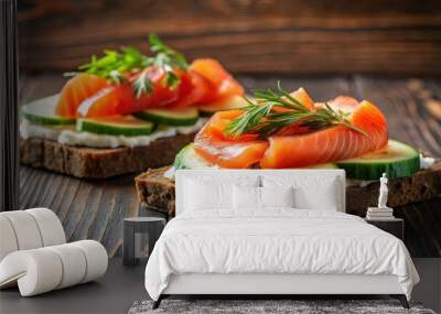 Traditional Danish smorrebrod sandwiches with salmon, cream cheese, cucumber, and tomatoes on black rye bread, on a dark brown wooden background Wall mural