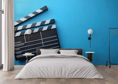 Two clapper boards on blue background, movie, film, slate, production, equipment, cinema, director, action, photography Wall mural