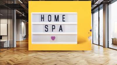 Lightbox with HOME SPA text. Yellow banner with lavender cosmetics products. Home body skin care Wall mural