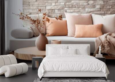 Minimal living room with wooden coffee table near sofa close-up. Interior in trendy peach colors Wall mural