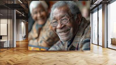 Multiracial seniors having fun during board game in geriatric clinic or nursing home Wall mural