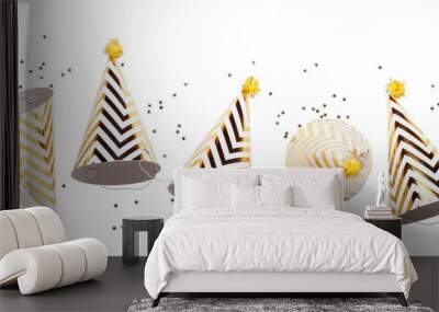 Striped golden cones hats and confetti on transparent background. Birthday holiday party concept Wall mural