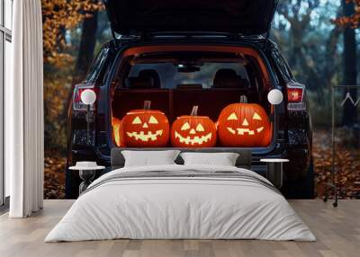 Trunk or treat scene with carved pumpkins in autumn forest setting Wall mural